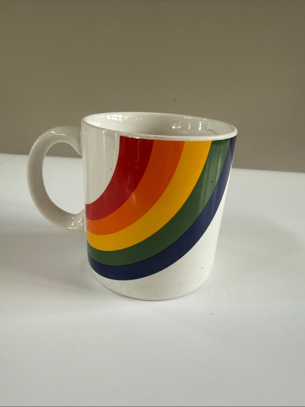 Vintage F.T.D.A White Ceramic Mug with Rainbow Stripe Design